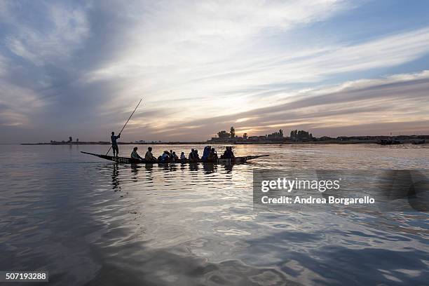 Boat transportation on the Niger River on January 22, 2010 in Mopti, Mali. Mopti is a town in the Inner Niger Delta region of Mali and it lies at the...