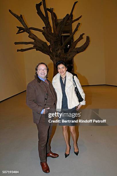 Bill Pallot and his companion Dina Daswani Lloyd attend the "Bentu" Exhibition at the Louis Vuitton Foundation, Co-organized with the "Ullens Center...