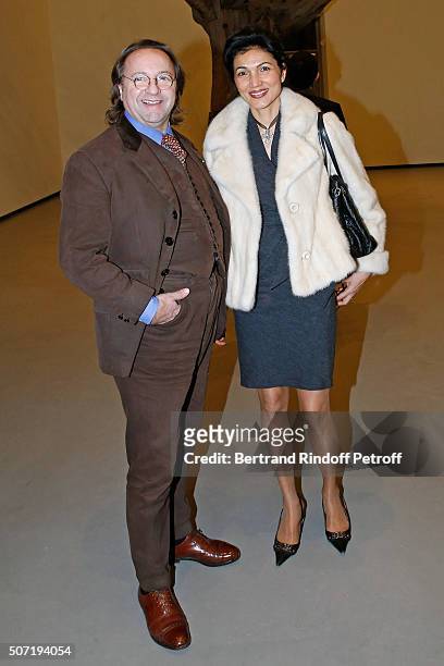 Bill Pallot and his companion Dina Daswani Lloyd attend the "Bentu" Exhibition at the Louis Vuitton Foundation, Co-organized with the "Ullens Center...