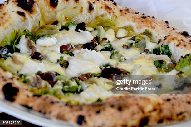 Pizza Patanegra Di Giuseppe Pignalosa: Steamed Cod, Mozzarella, Escarole, Gaeta Olives, Capers, Anchovies and Lemon Peel.