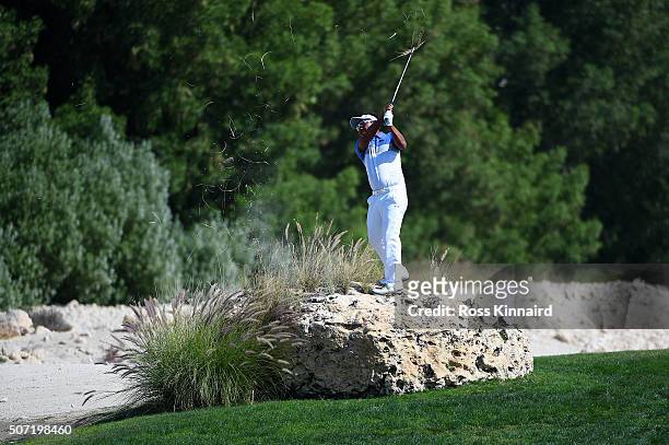Thongchai Jaidee of Thailand plays his second shot from the top of a rock on the 4th during the second round of the Commercial Bank Qatar Masters at...