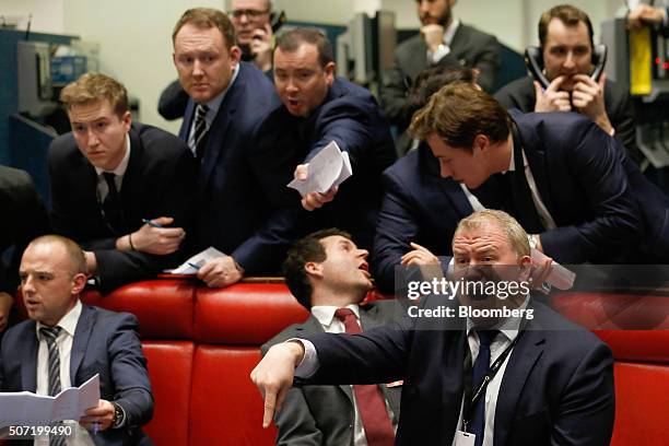 Traders, brokers and clerks shout and gesture on the trading floor of the open outcry pit at the London Metal Exchange , on the last day of trading...