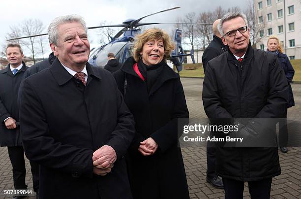 German President Joachim Gauck, his partner Daniela Schadt and Interior Minister Thomas de Maiziere visit a BFEplus Police Unit on January 28, 2016...