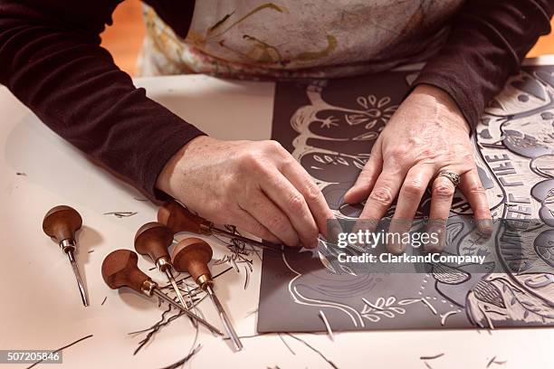 close up of a printmaker artist at work - linoleum stock pictures, royalty-free photos & images