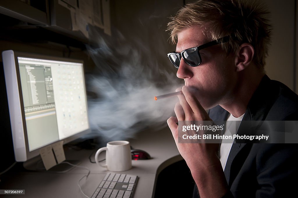 Smoking E-cigarette in secret in office