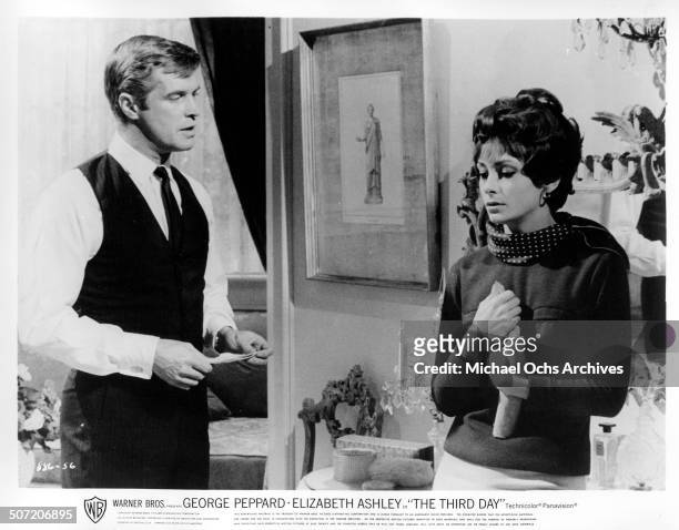 George Peppard defends himself after Elizabeth Ashley receives a letter in a scene from the Warner Bros. Movie "The Third Day", circa 1965.