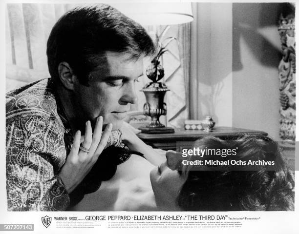 George Peppard an Elizabeth Ashley share a tender moment in a scene from the Warner Bros. Movie "The Third Day", circa 1965.
