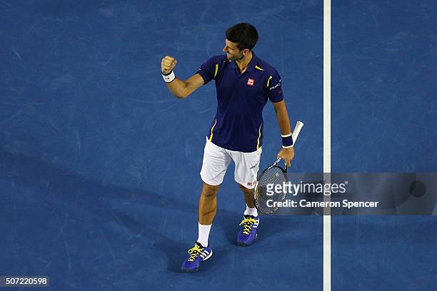 Novak Djokovic of Serbia celebrates winning his semi final match against Roger Federer of Switzerland during day 11 of the 2016 Australian Open at...