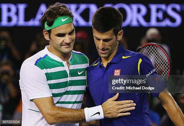 Novak Djokovic of Serbia is congratulated after winning in his semi final match against Roger Federer of Switzerland during day 11 of the 2016...