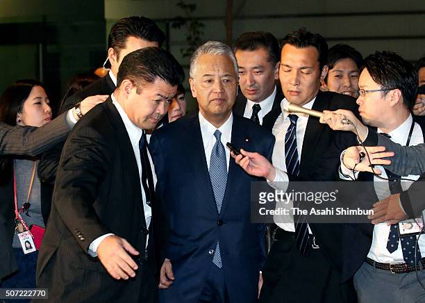 Economy minister Akira Amari enters Prime Minister Shinzo Abe's official residence to submit his resignation letter on January 28, 2016 in Tokyo,...