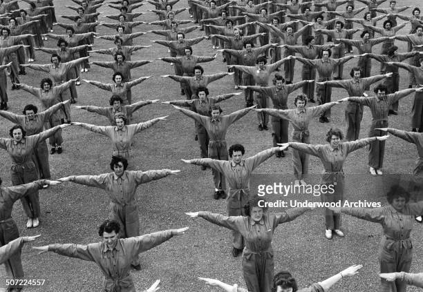 Women exercising as part of their training to become US Navy Aviation Machinist's Mates at the Naval Air Technical Training Center , Norman,...