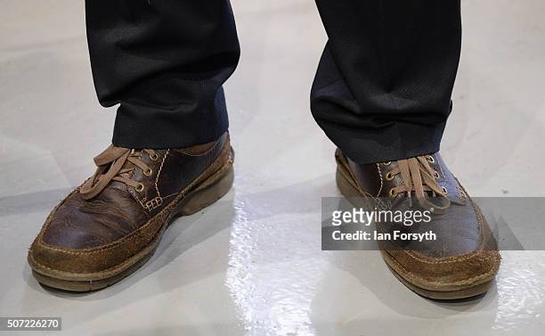 The shoes of Jeremy Corbyn MP, leader of the Labour Party are seen as he stands listening to a briefing during a visit to the Science, Technology,...