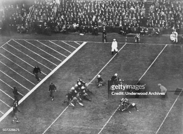 Yale halfback Albie Booth ends his college career with a dropkick that beat Harvard 3 to 0 at Soldiers Field in the 50th annual football game between...