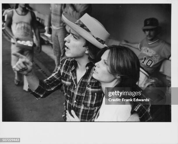 Singer and actor David Cassidy and his wife, actress Kay Lenz, attending the 'Happy Days' baseball game at Dodgers Stadium, Los Angeles, CA, August...