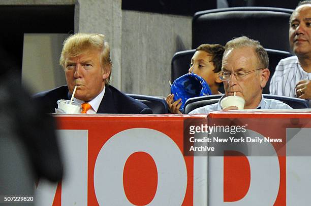 Donald Trump and Bill O'Reilly drink milkshakes during a New York Yankees game against the Oakland Athletics on August 30, 2010 at Yankee Stadium in...