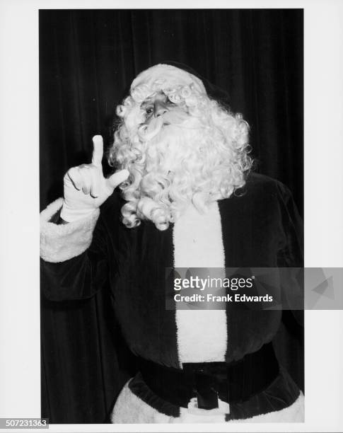 Actor Eric Estrada wearing a Santa Claus costume at the Annual Golden Apple Awards, Beverly Wiltshire Hotel, California, December 13th 1981.