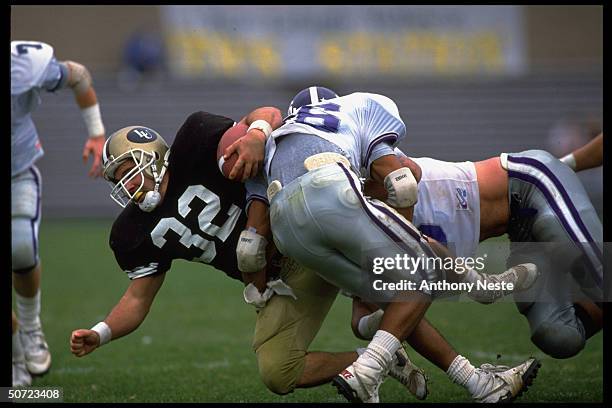 James Scott & Todd Araujo of Holy Cross in action vs Laurence Arico of Lehigh.