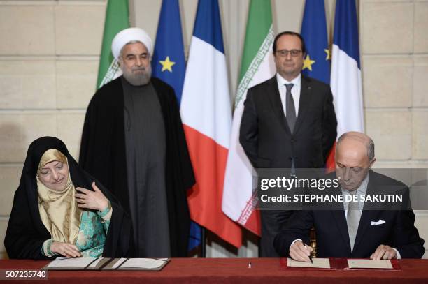 French Foreign Minister Laurent Fabius , Iranian Minister of State for Environmental Protection, Masoumeh Ebtekar , Iranian President Hassan Rouhani...