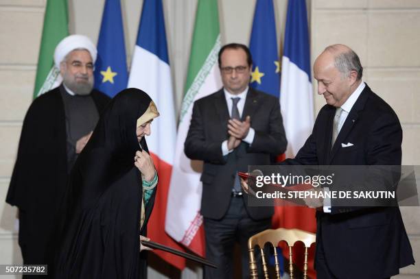 French Foreign Minister Laurent Fabius , Iranian Minister of State for Environmental Protection, Masoumeh Ebtekar , Iranian President Hassan Rouhani...