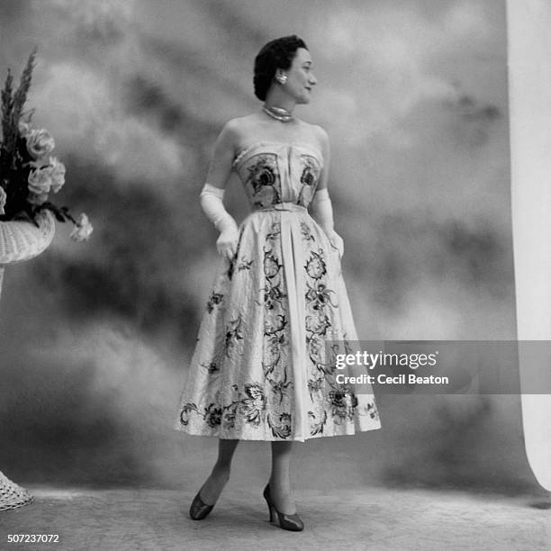 Duchess of Windsor wearing Dior strapless short flowered-and-beaded ball gown and diamond choker.