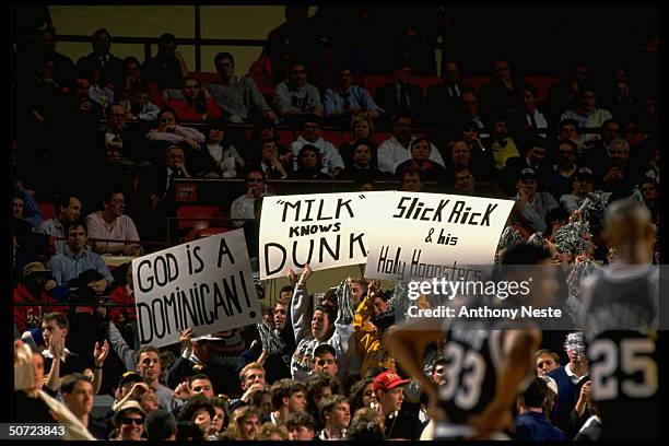 Big East. Providence fans holding signs.; Signs read: GOD IS DOMINICAN. MILK KNOWS DUNK. SLICK RICK & HIS HOLY HOOOSTERS.;