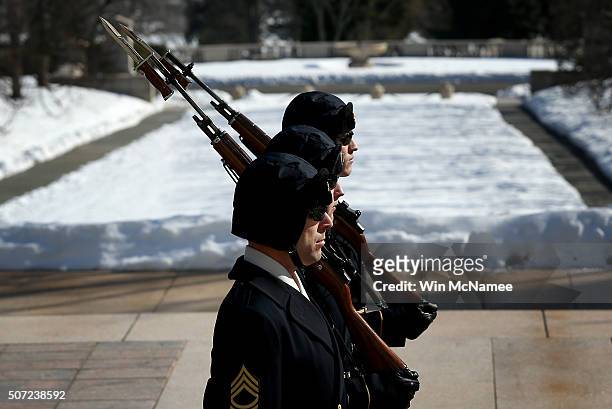 Members of the "Old Guard" take part in a changing of the guard ceremony at the Tomb of the Unknown Solider at Arlington National Cemetery January...
