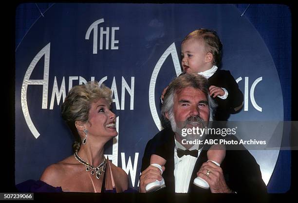 Backstage Coverage - Airdate: January 17, 1983. KENNY ROGERS, FAVORITE COUNTRY MALE ARTIST WITH WIFE MARIANNE GORDON AND THEIR SON CHRISTOPHER ROGERS