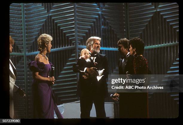 Show Coverage - Airdate: January 17, 1983. KENNY ROGERS , FAVORITE COUNTRY MALE ARTIST, WIFE MARIANNE GORDON AND THEIR SON CHRISTOPHER ROGERS WITH...