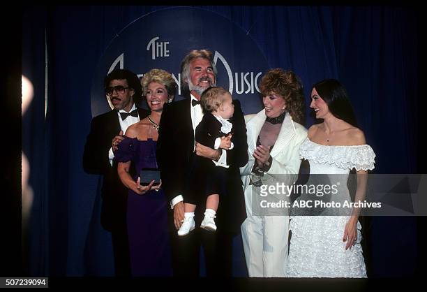 Backstage Coverage - Airdate: January 17, 1983. KENNY ROGERS , FAVORITE COUNTRY MALE ARTIST, WIFE MARIANNE GORDON AND THEIR SON CHRISTOPHER ROGERS...