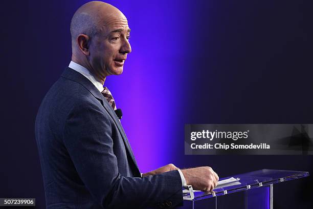 Amazon founder and Washington Post owner Jeff Bezos delivers remarks during the opening ceremony of the media company's new location January 28, 2016...