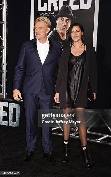 Actor Dolph Lundgren and Jenny Sandersson arrive at the premiere of Warner Bros. Pictures' 'Creed' at Regency Village Theatre on November 19, 2015 in...