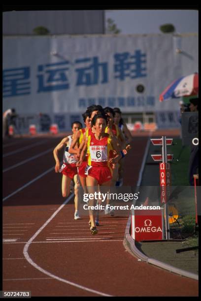 View of Chinese long-distance runner, track athlete Wang Junxia as she competes in the Women's 3,000 meter race during the Chinese National Games,...