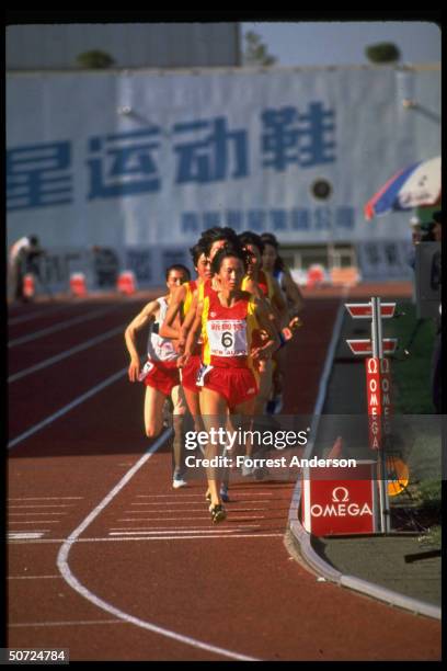 View of Chinese long-distance runner, track athlete Wang Junxia as she competes in the Women's 3,000 meter race during the Chinese National Games,...