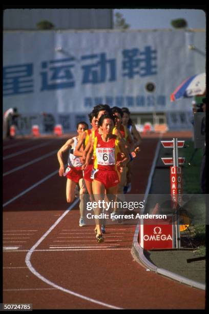 View of Chinese long-distance runner, track athlete Wang Junxia as she competes in the Women's 3,000 meter race during the Chinese National Games,...