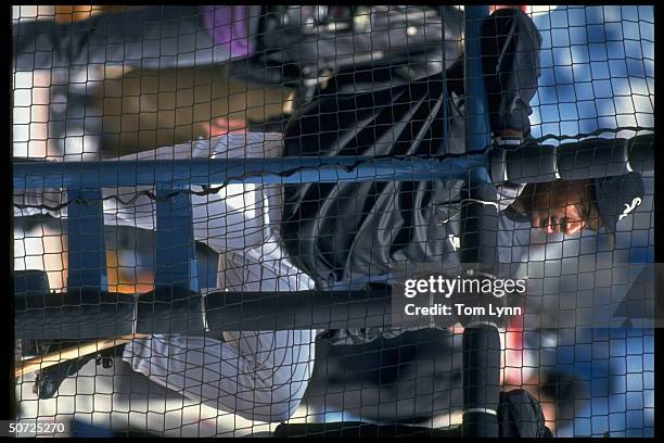 Portrait of Chicago White Sox Bo Jackson alone behind net.