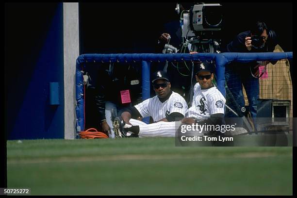 Portrait of Chicago White Sox Bo Jackson w. Jose Cora.; Sitting on field.;