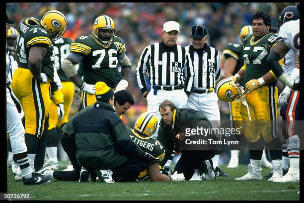 Green Bay Packers Ken Ruettgers w. Trainers during injury vs Chicago Bears.