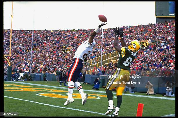 Green Bay Packers Sterling Sharpe in action vs Chicago Bears Donnell Woolford.; Woolford forcing IP;