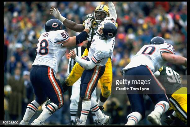 Chicago Bears QB Jim Harbaugh in action vs Green Bay Packers Reggie White.