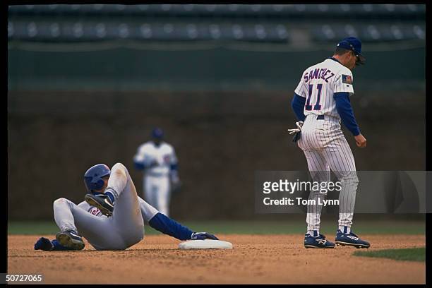 Mets David Segui in action vs Chicago Cubs Rey Sanchez.
