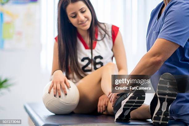 working on a ankle injury - volleyball sport stock pictures, royalty-free photos & images