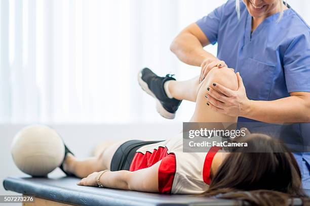 volleyball player in physical therapy - teen and doctor stock pictures, royalty-free photos & images