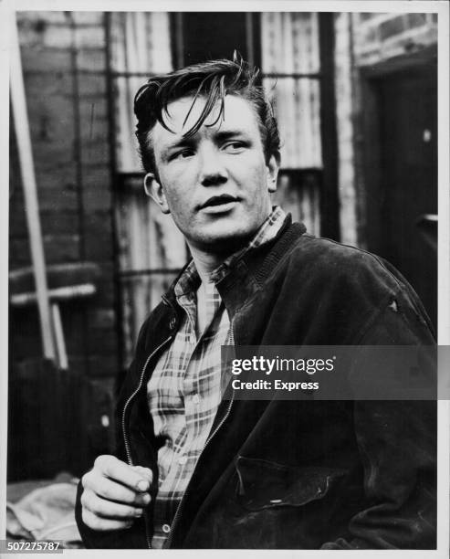 Actor Albert Finney on a film set, wearing a jacket and plaid shirt, October 26th 1960.