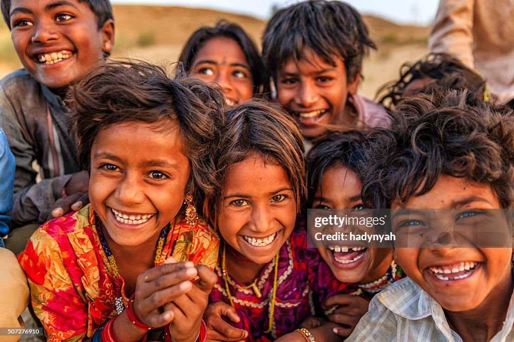 Group of happy Gypsy Indian children, desert village, India