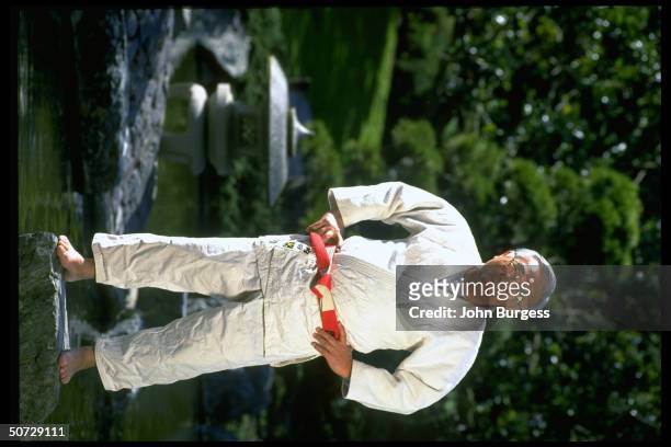 Portrait of San Jose St. Coach Yosh Uchida posing in Japanese Friendship Garden.