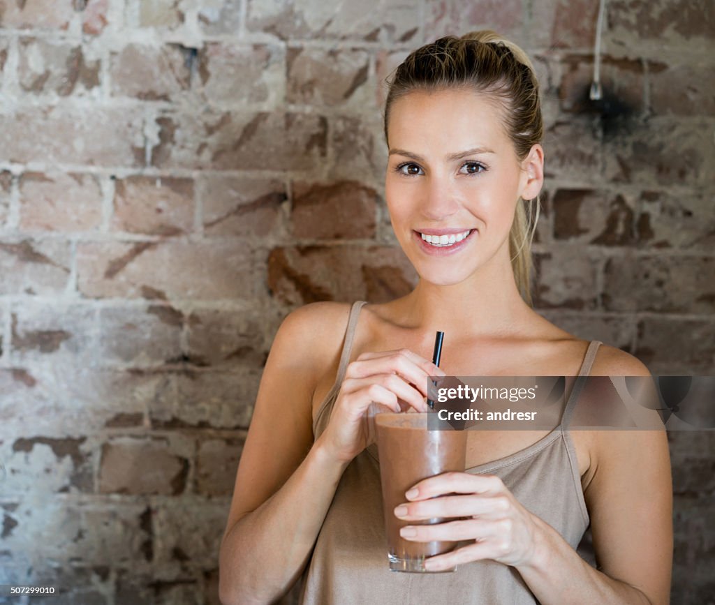 Woman having a milkshake