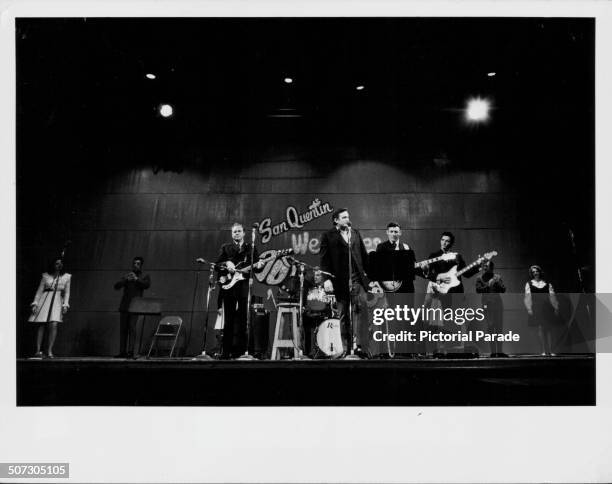Musician Johnny Cash on stage with his band, in concert at San Quentin State Prison, California, February 24th 1969.