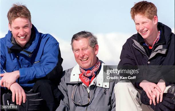 England's Prince Charles poses with sons Prince William and Prince Harry on Madrisa during vacation.