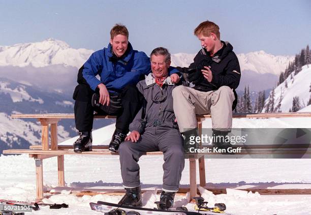 England's Prince Charles poses with sons Prince William and Prince Harry on Madrisa during vacation.