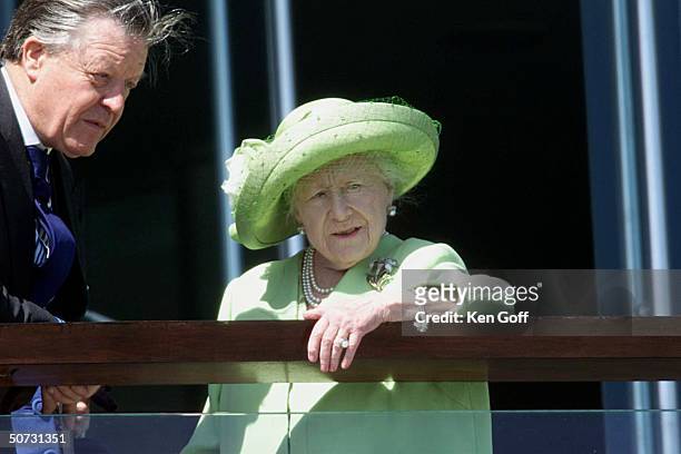 Queen Mother & unident at the Epsom Derby, where an unseen streaker passed finish line.